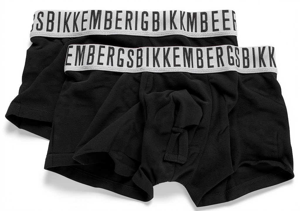 Boxer Bikkembergs Uomo Parigamba in cotone ed elastan, indossati su una scrivania di legno